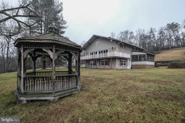 a view of room with window and dresser
