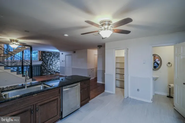 a view of a hallway with paintings on the wall