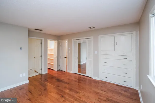 a view of empty room with wooden ceiling