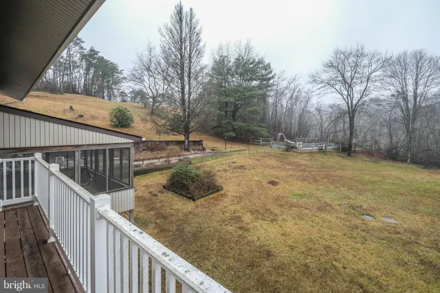 a bathroom with a granite countertop double vanity sink and a mirror