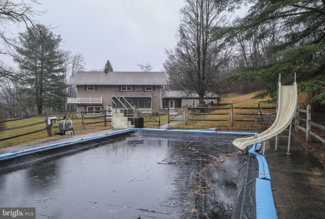a stove top oven sitting inside of a kitchen