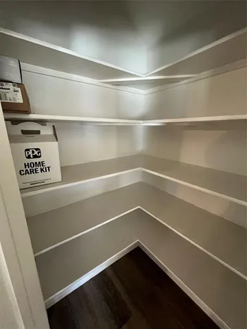 a view of a room with an empty walk in closet