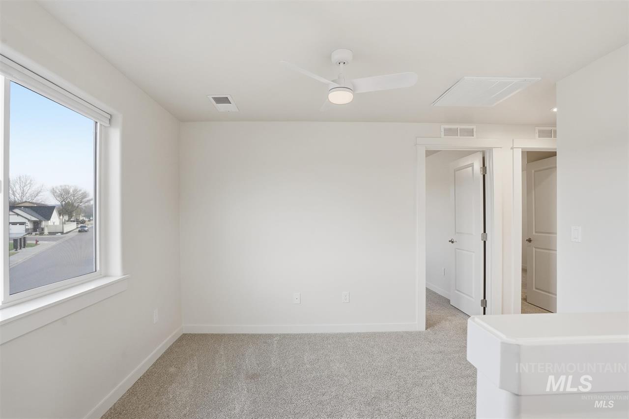 449 West Winnipeg Street Meridian, ID 83642 - Photo 25 of 49 Spare room featuring light colored carpet and ceiling fan