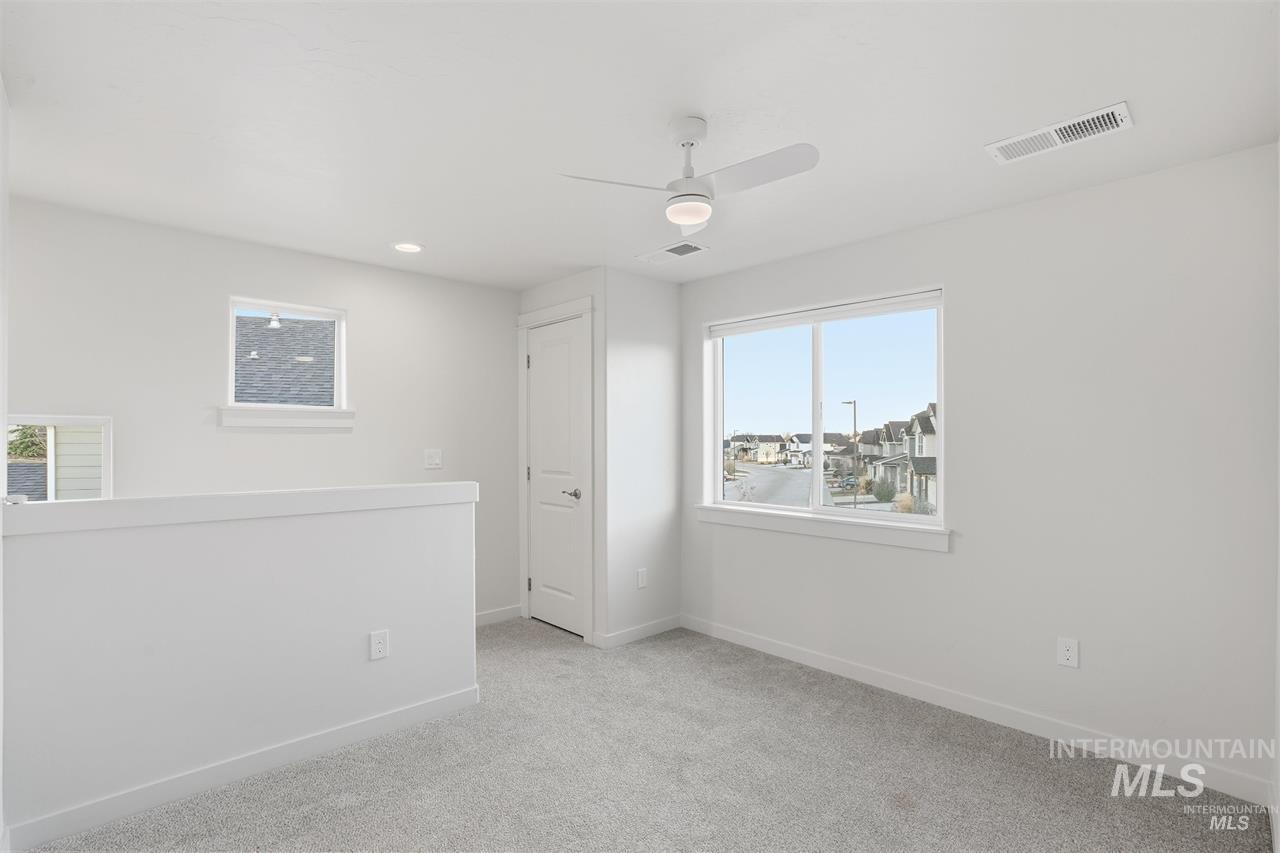 449 West Winnipeg Street Meridian, ID 83642 - Photo 27 of 49 Spare room featuring light colored carpet, ceiling fan, and recessed lighting