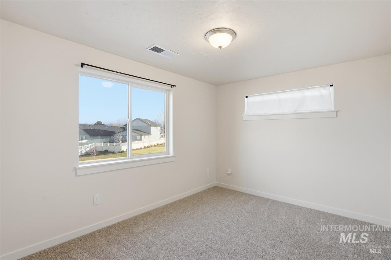449 West Winnipeg Street Meridian, ID 83642 - Photo 31 of 49 Unfurnished room featuring baseboards and light colored carpet