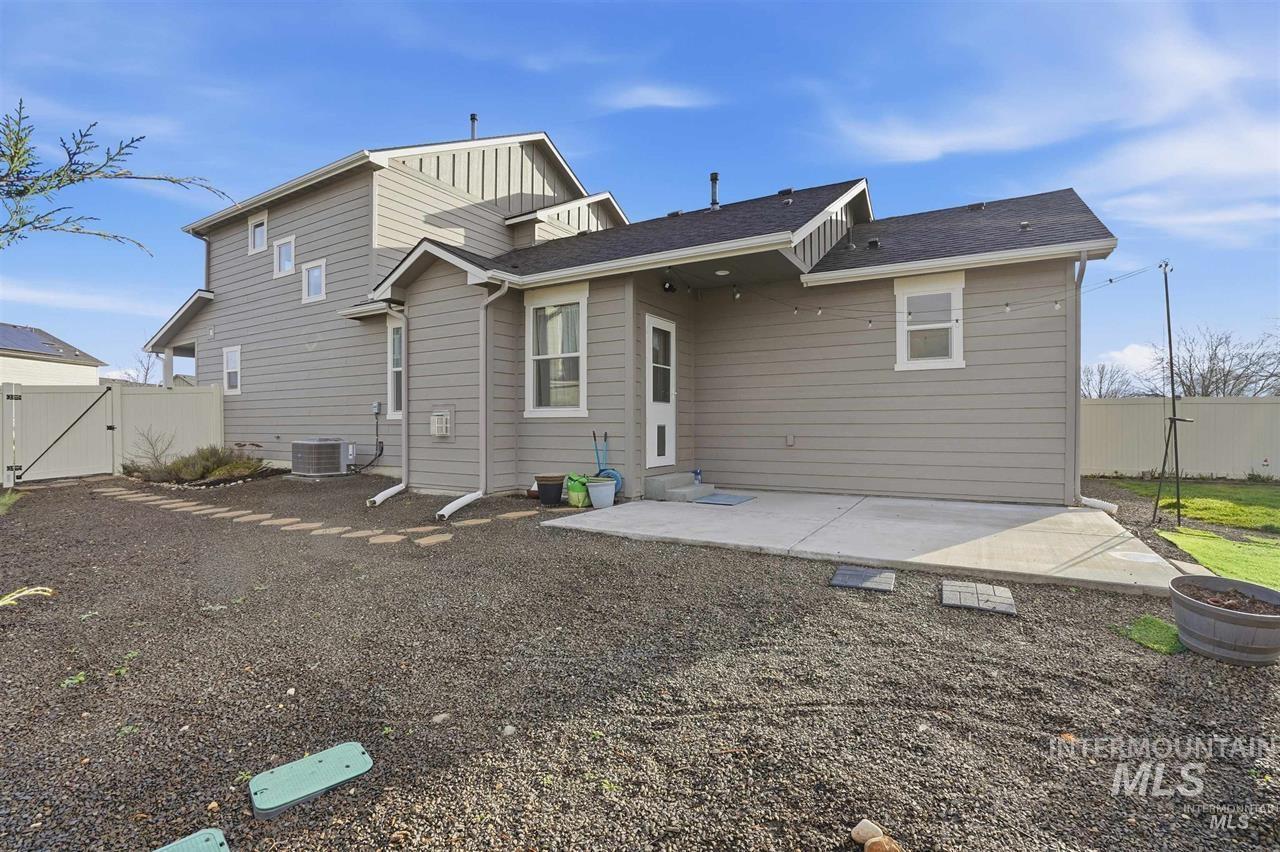 449 West Winnipeg Street Meridian, ID 83642 - Photo 38 of 49 Back of property featuring a gate, a fenced backyard, and a patio area