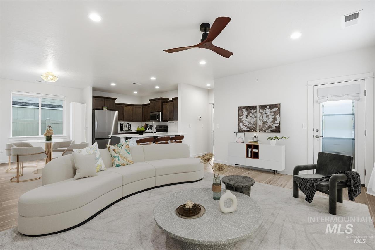 449 West Winnipeg Street Meridian, ID 83642 - Photo 9 of 49 Living room featuring healthy amount of natural light, light wood-type flooring, a ceiling fan, and recessed lighting
