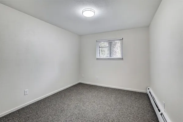 an empty room with a empty space and window