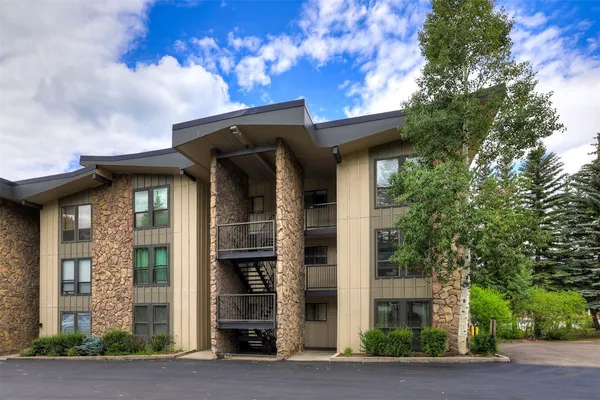a house with a tree in front of it
