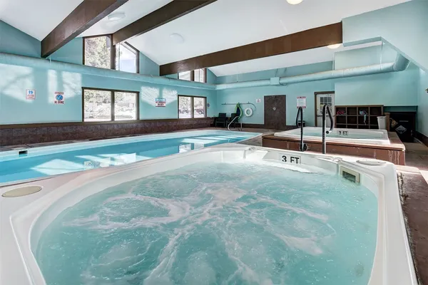 a swimming pool with outdoor seating