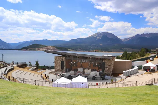 a view of a patio with table and chairs and potted plants