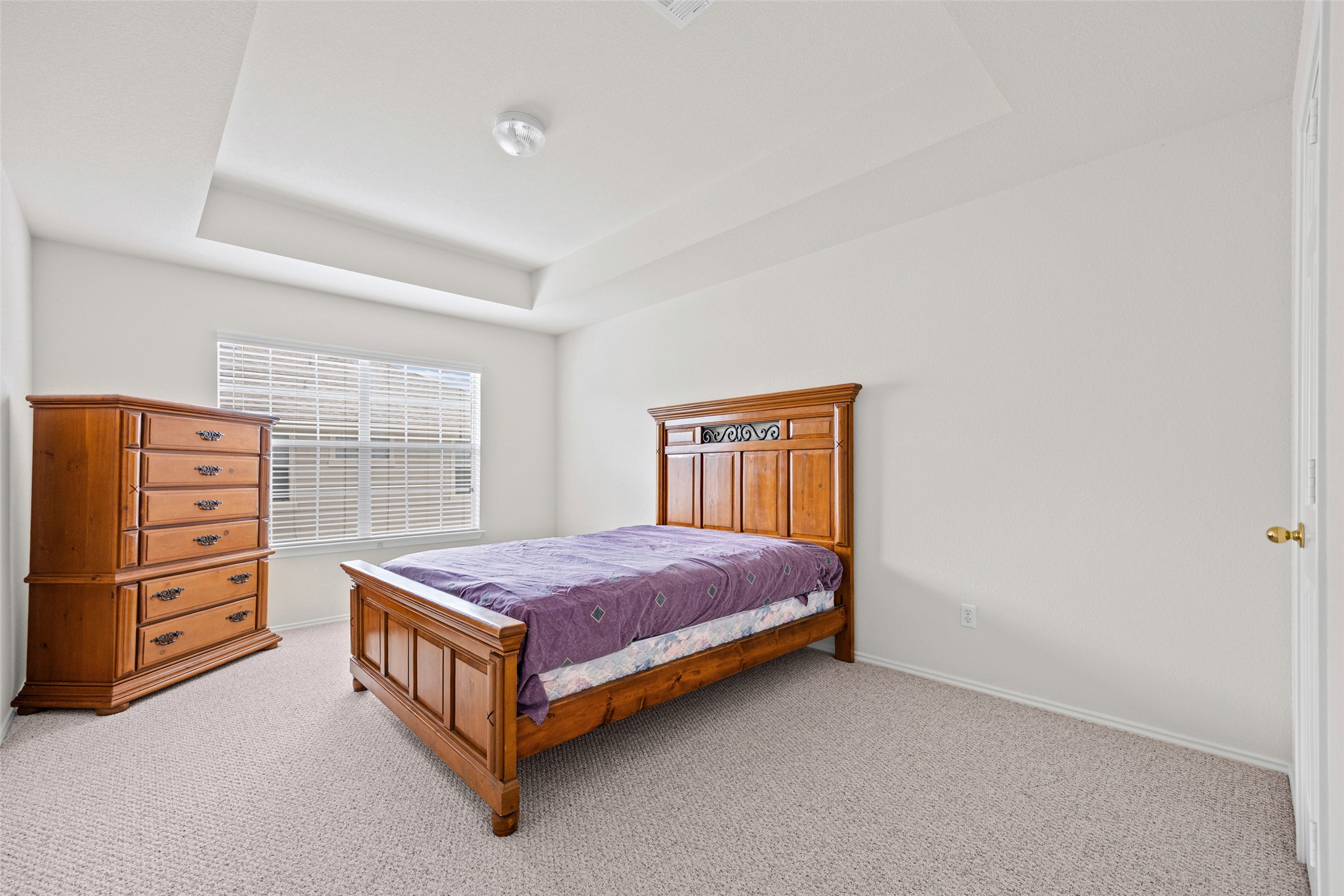 1900 Scofield Ridge Parkway, Unit 503 Austin, TX 78727 - Photo 21 of 26 a living room with a bed and dresser