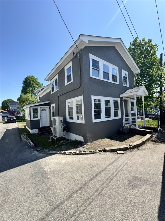 16 Adams Street, Unit 1 Boston, MA 02136 - Photo 2 of 15 a front view of a house with a yard