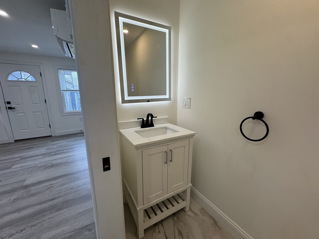 16 Adams Street, Unit 1 Boston, MA 02136 - Photo 5 of 15 a bathroom with a sink and a mirror