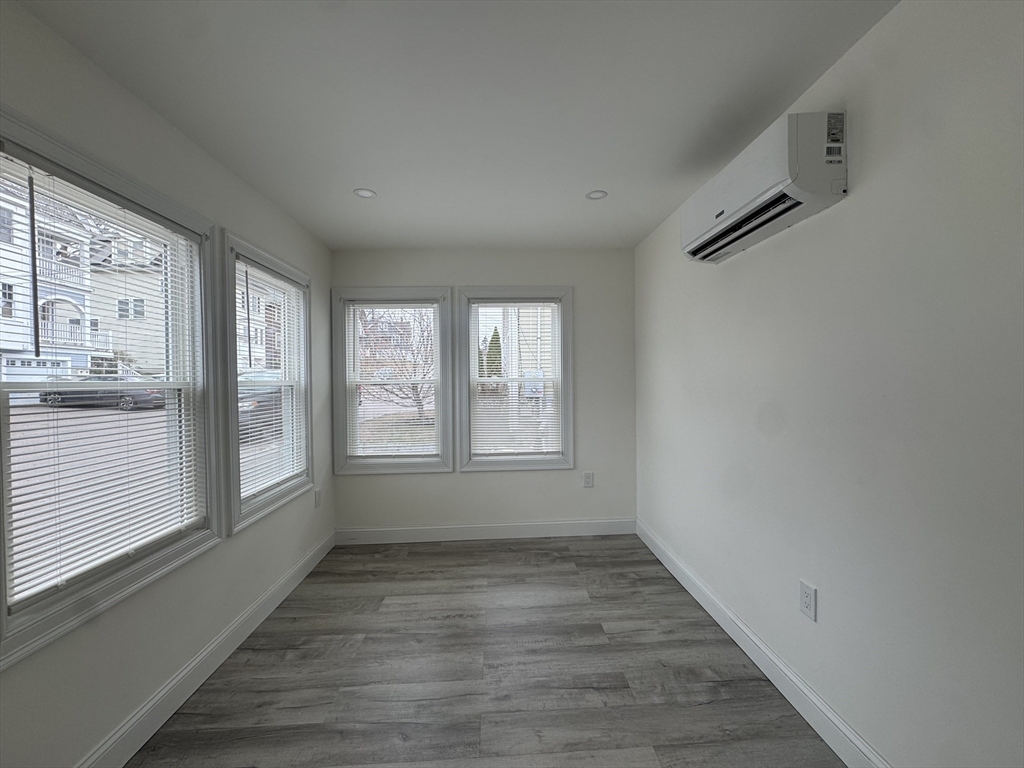 16 Adams Street, Unit 1 Boston, MA 02136 - Photo 6 of 15 a view of an empty room with a window