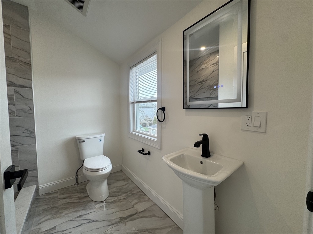 16 Adams Street, Unit 1 Boston, MA 02136 - Photo 10 of 15 a bathroom with a sink and a toilet
