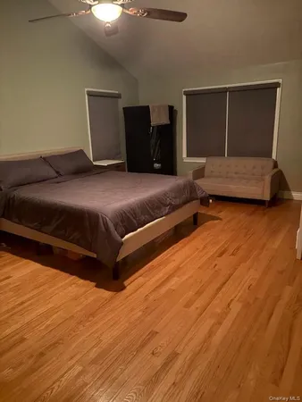 a bedroom with a bed and window