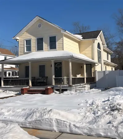 a view of a house with outdoor seating