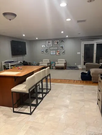 a outdoor space with furniture lots of furniture and flat screen tv