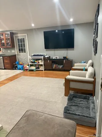 a room with furniture and a flat screen tv