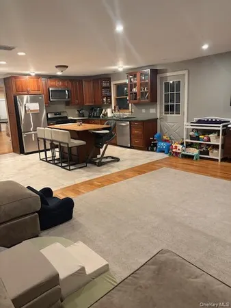 a living room filled with furniture and a flat screen tv
