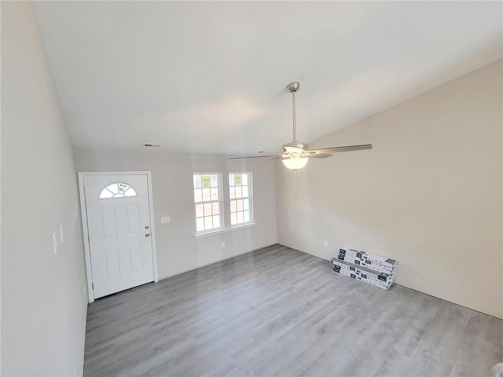 1049 East Hanover Road Graham, NC 27253 - Photo 5 of 14 a view of an empty room with a window
