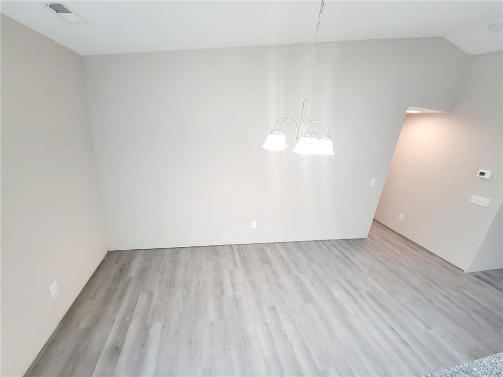 1049 East Hanover Road Graham, NC 27253 - Photo 6 of 14 a view of an empty room and wooden floor