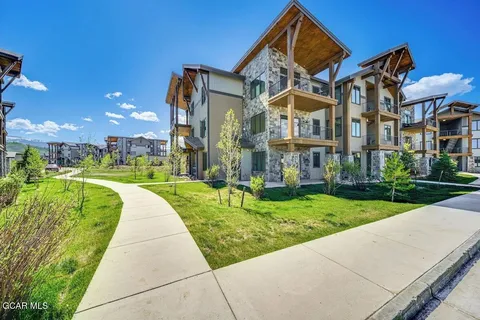 a view of a building with a yard