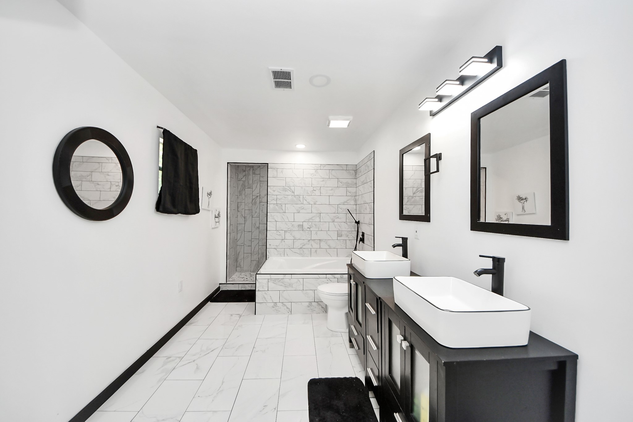 238 Waterfall Drive Huffman, TX 77336 - Photo 21 of 40 a spacious bathroom with a double vanity sink a mirror and a toilet