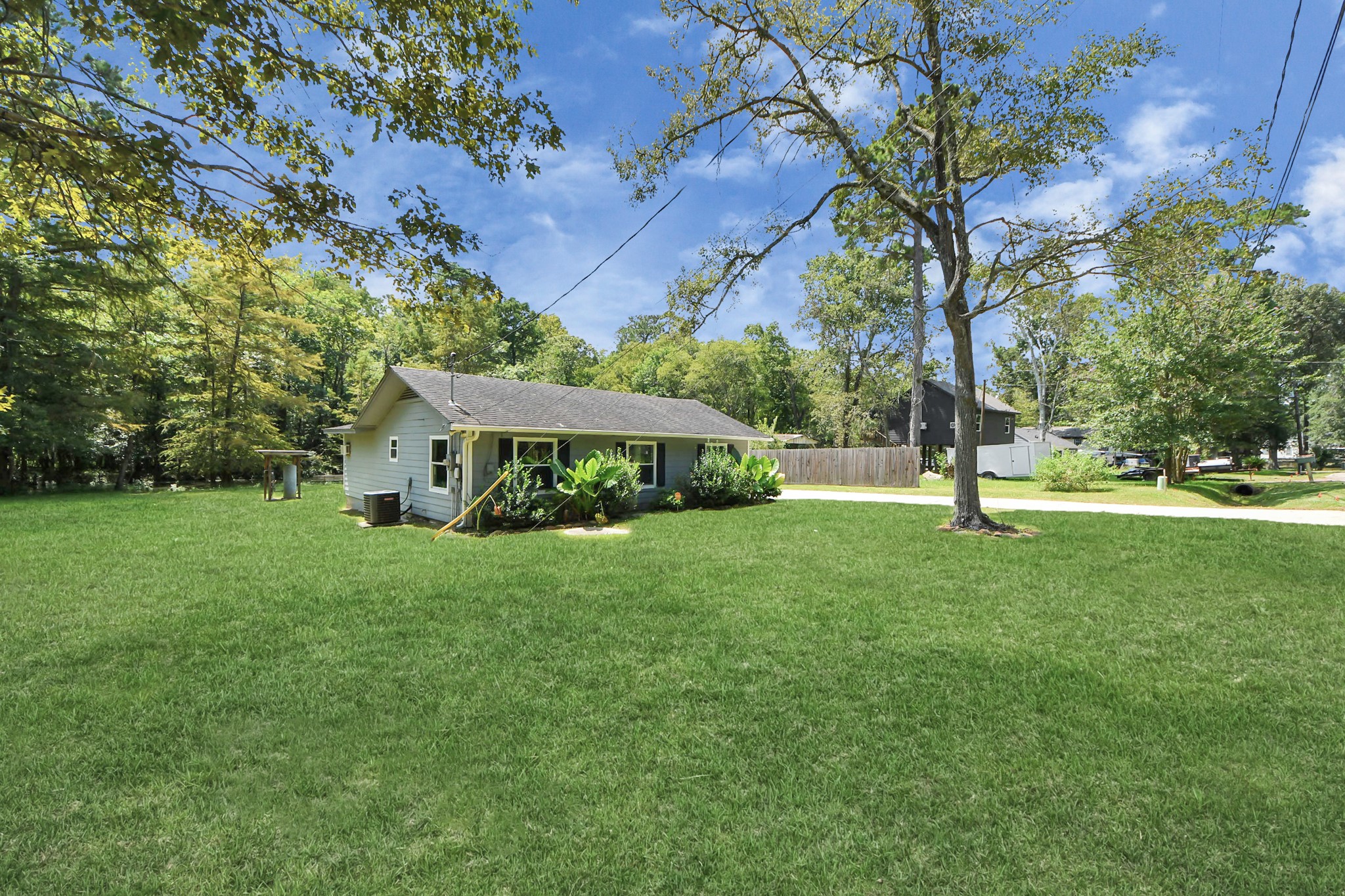 238 Waterfall Drive Huffman, TX 77336 - Photo 32 of 40 a view of a house with a backyard