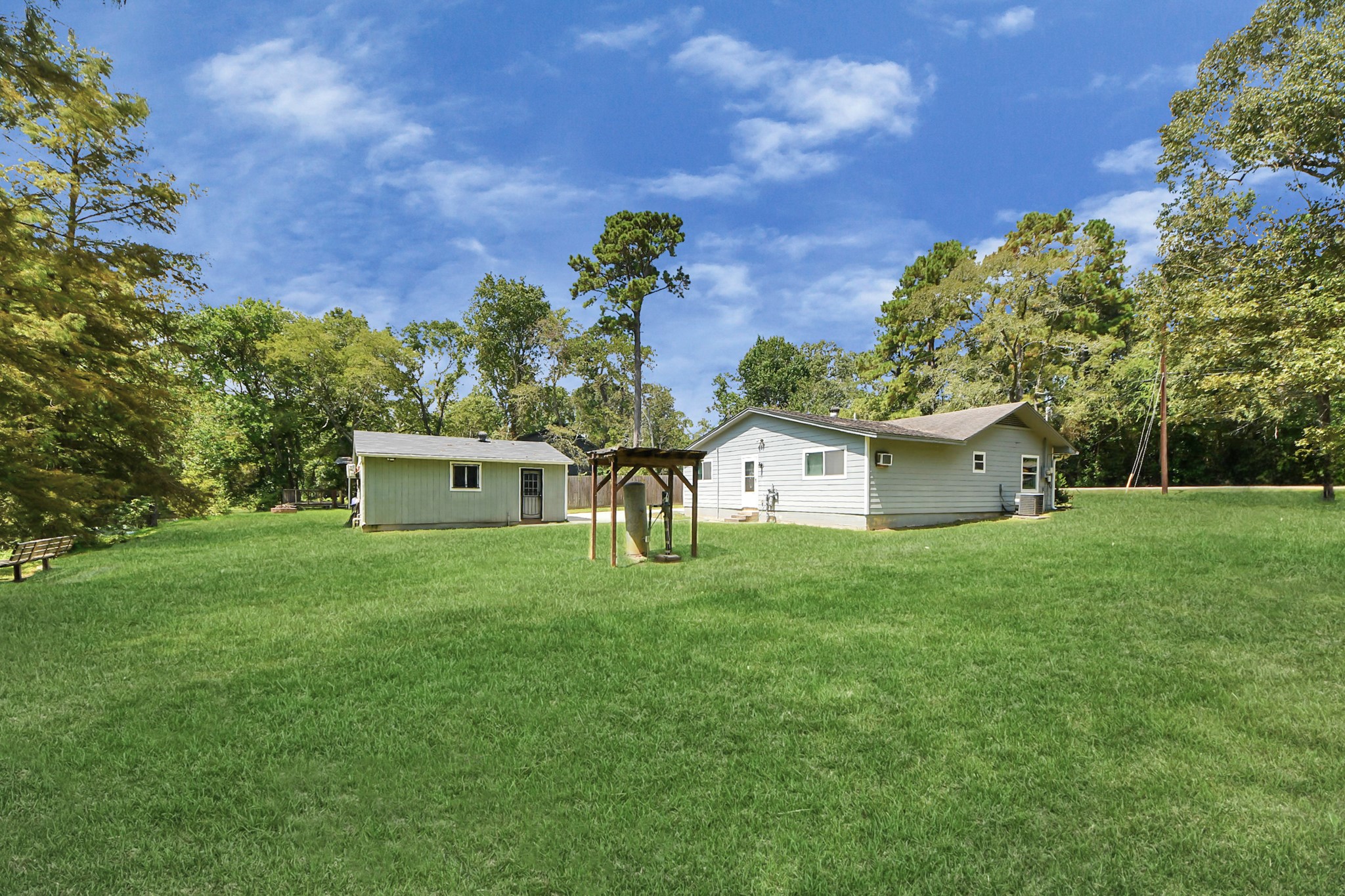 238 Waterfall Drive Huffman, TX 77336 - Photo 33 of 40 a front view of a house with a yard and a garage