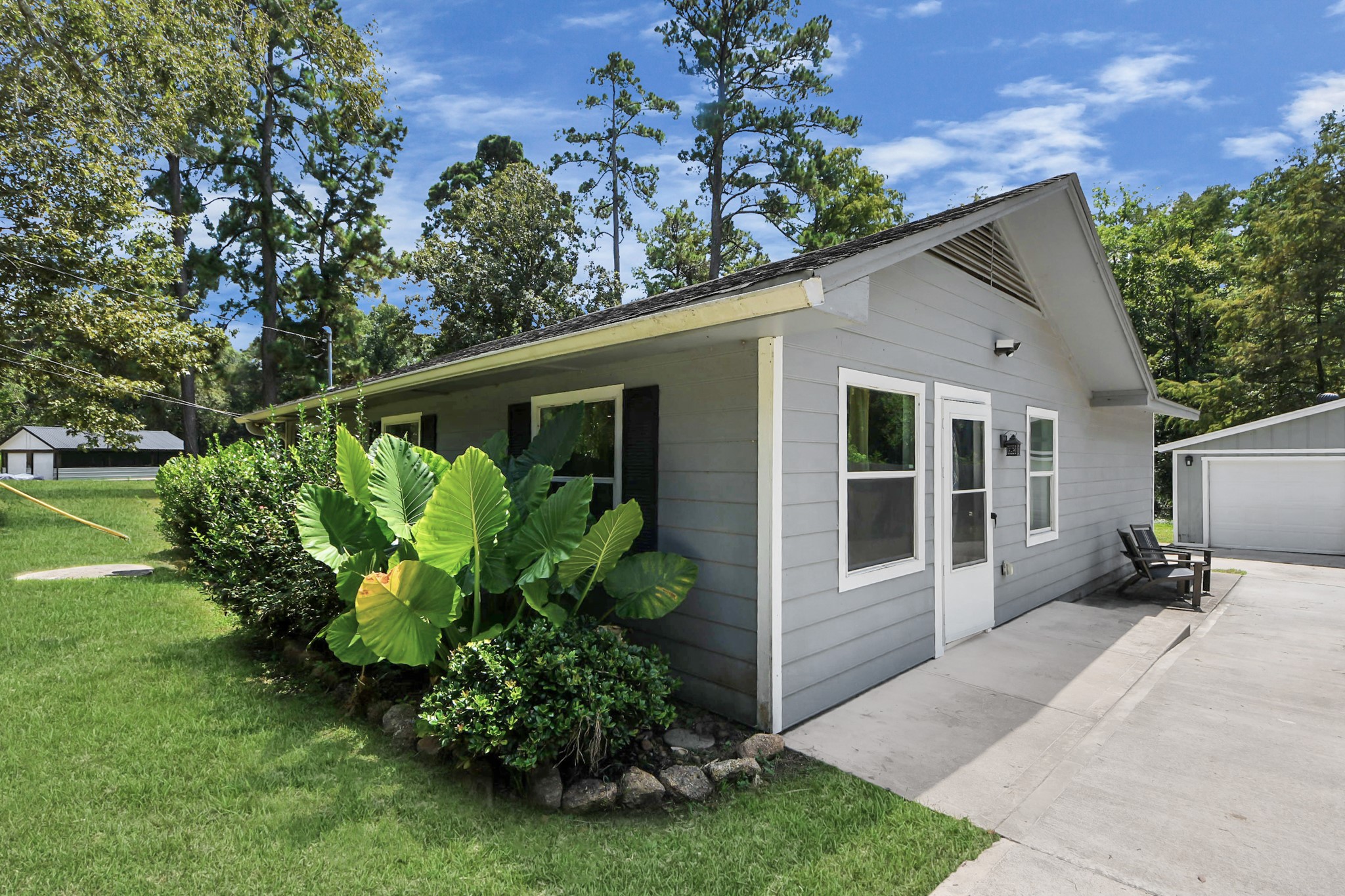 238 Waterfall Drive Huffman, TX 77336 - Photo 7 of 40 a backyard of a house with lots of green space