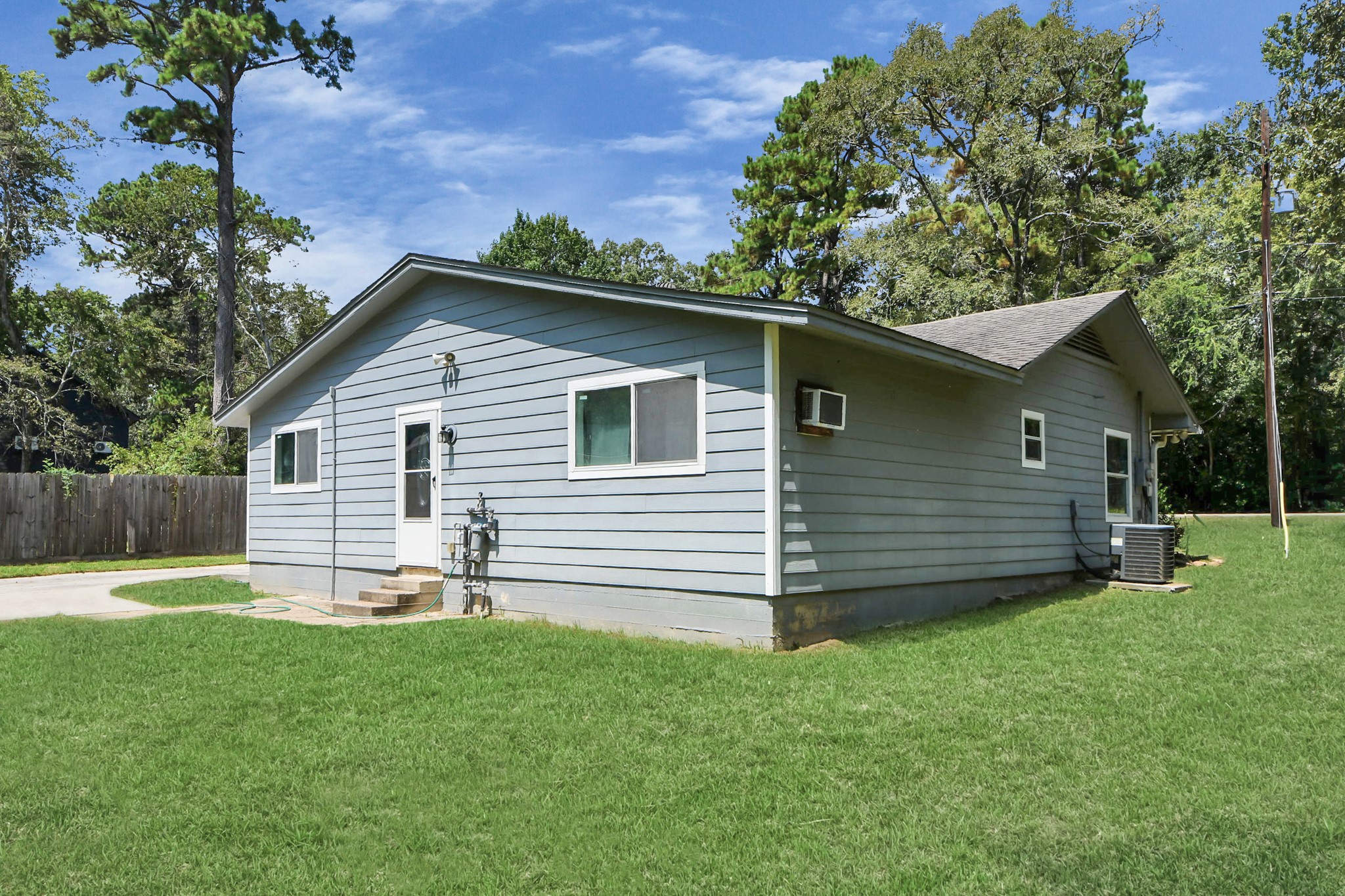 238 Waterfall Drive Huffman, TX 77336 - Photo 9 of 40 a front view of a house with a yard
