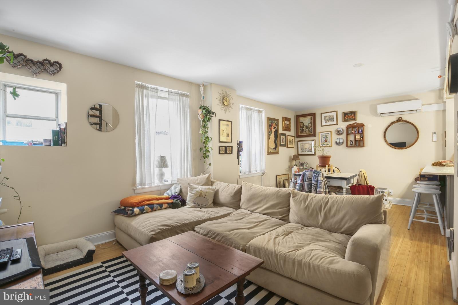 44 South 3rd Street, Unit 4R Philadelphia, PA 19106 - Photo 3 of 19 a living room with furniture and a window