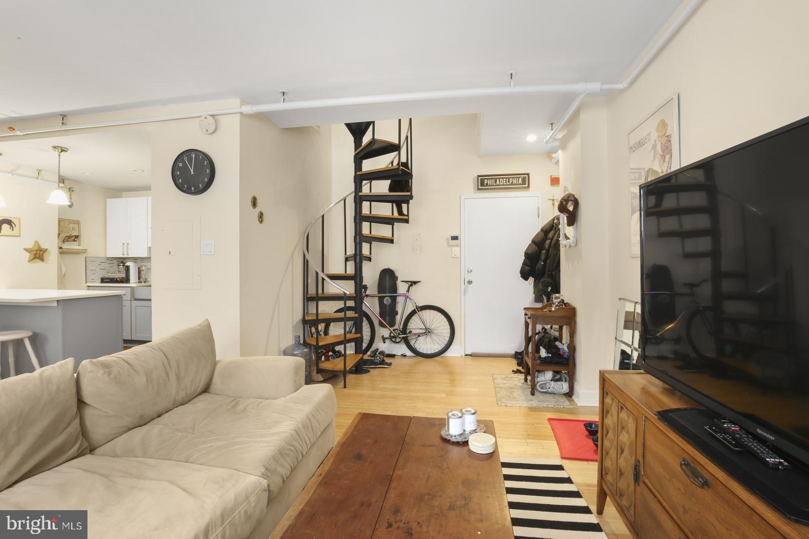 44 South 3rd Street, Unit 4R Philadelphia, PA 19106 - Photo 4 of 19 a living room with patio furniture and a flat screen tv