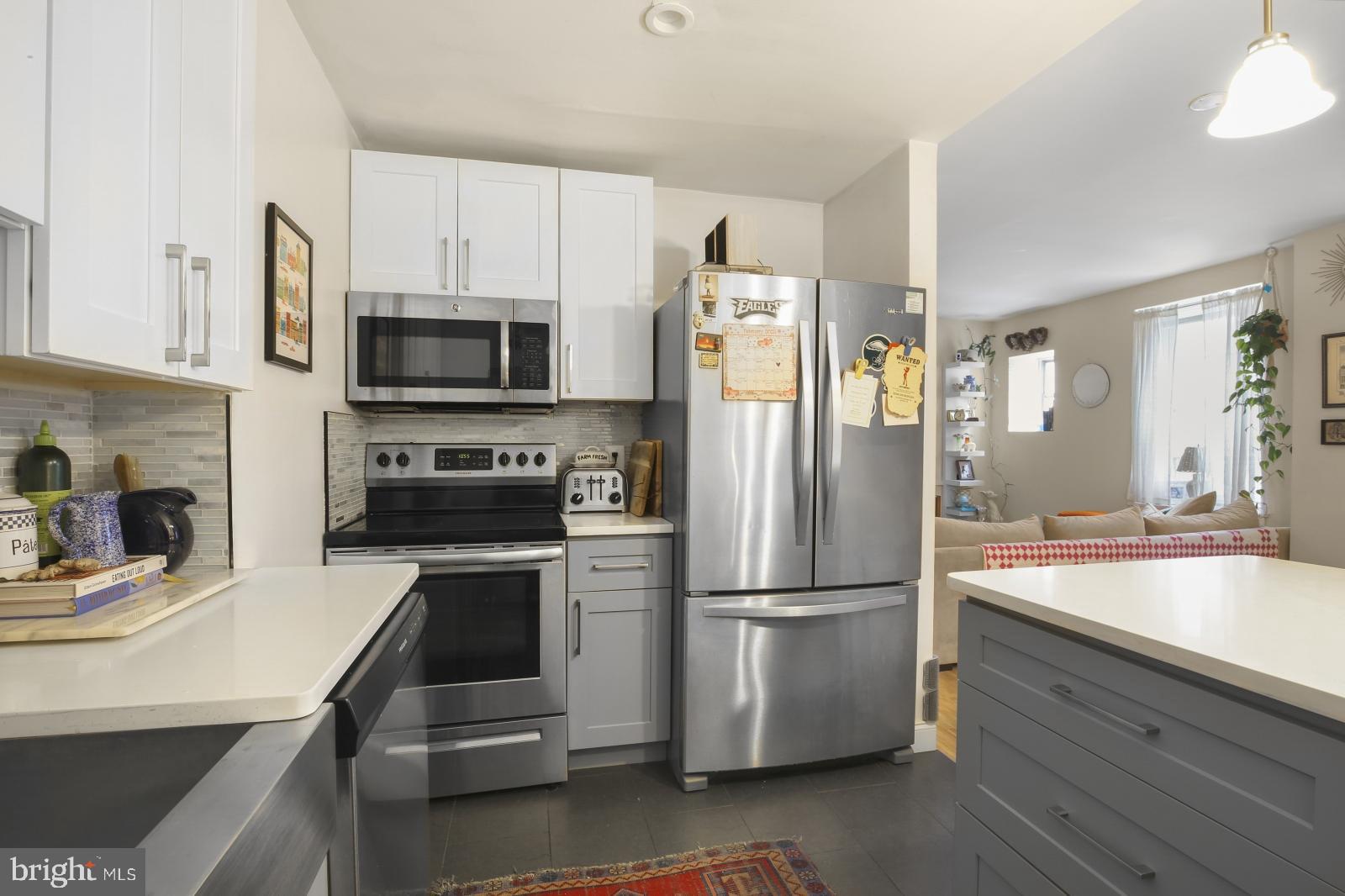 44 South 3rd Street, Unit 4R Philadelphia, PA 19106 - Photo 8 of 19 a kitchen with a refrigerator stove and sink