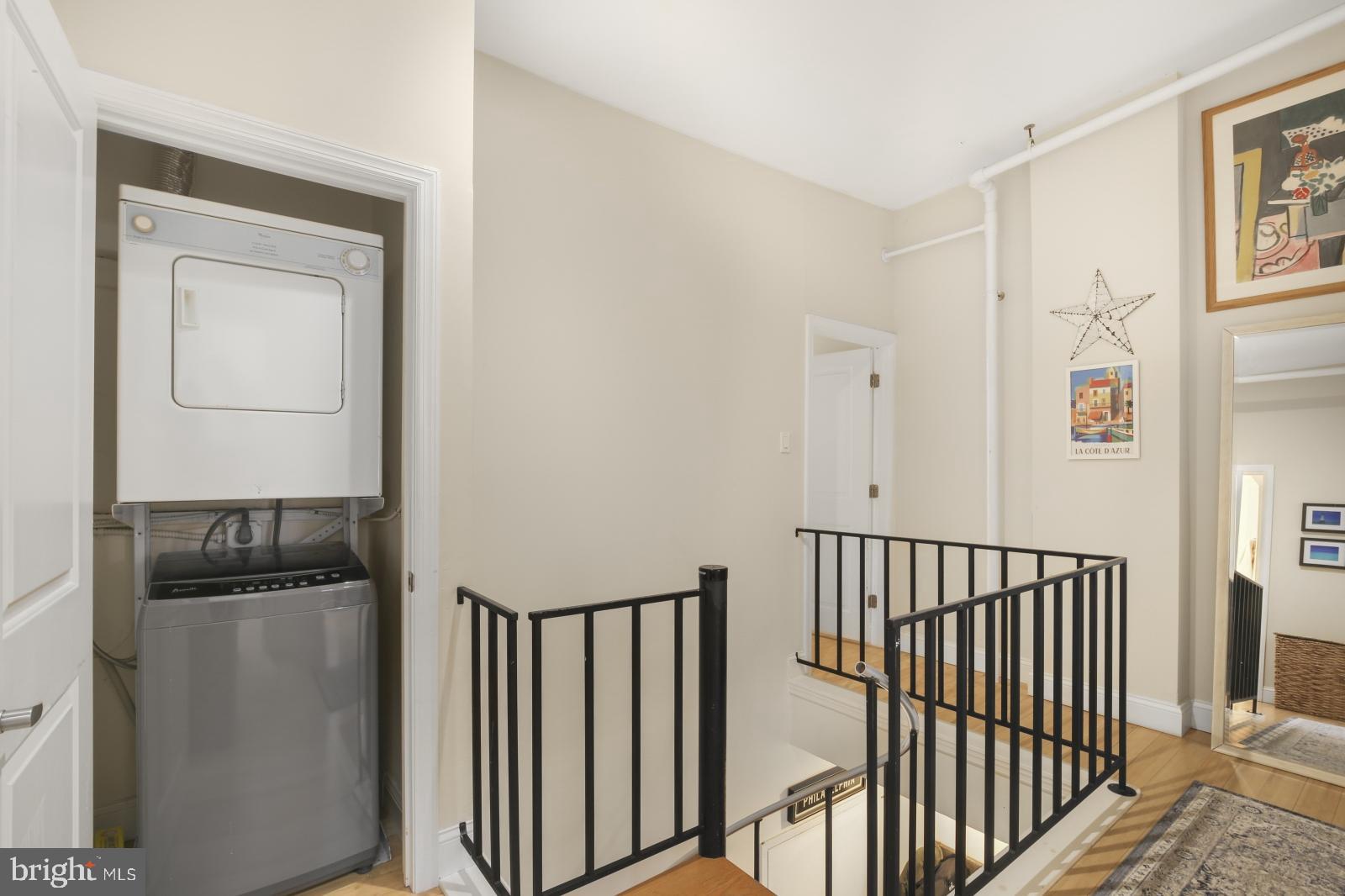 44 South 3rd Street, Unit 4R Philadelphia, PA 19106 - Photo 10 of 19 a view of a hallway with wooden floor and staircase