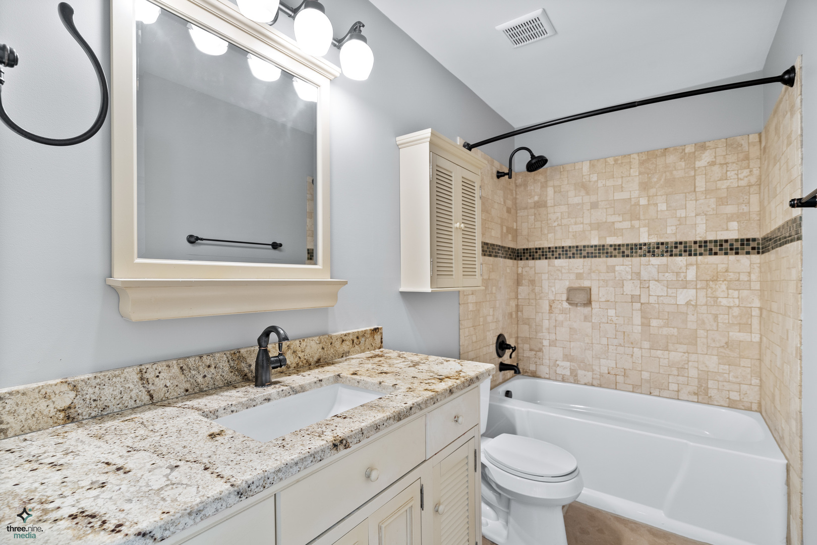 1809 Prairie Ridge Drive Plainfield, IL 60586 - Photo 18 of 32 a bathroom with a granite countertop sink toilet a mirror and shower