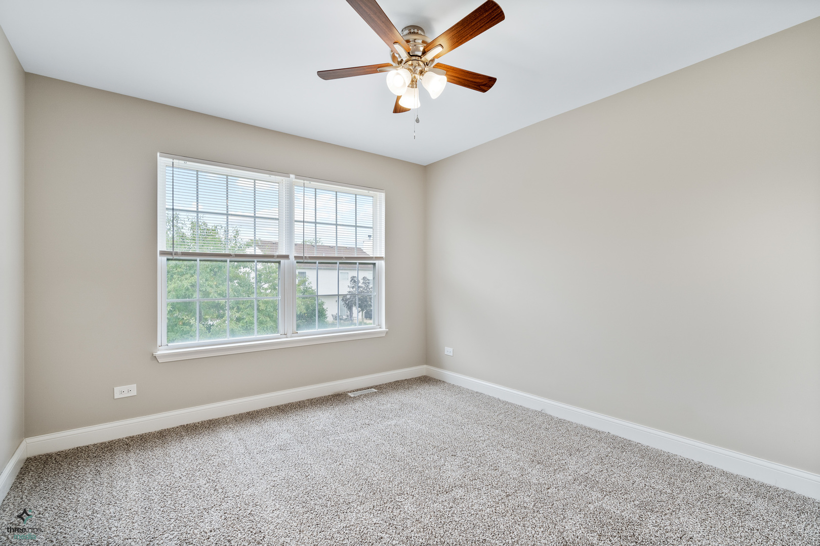 1809 Prairie Ridge Drive Plainfield, IL 60586 - Photo 19 of 32 an empty room with a window and a fan