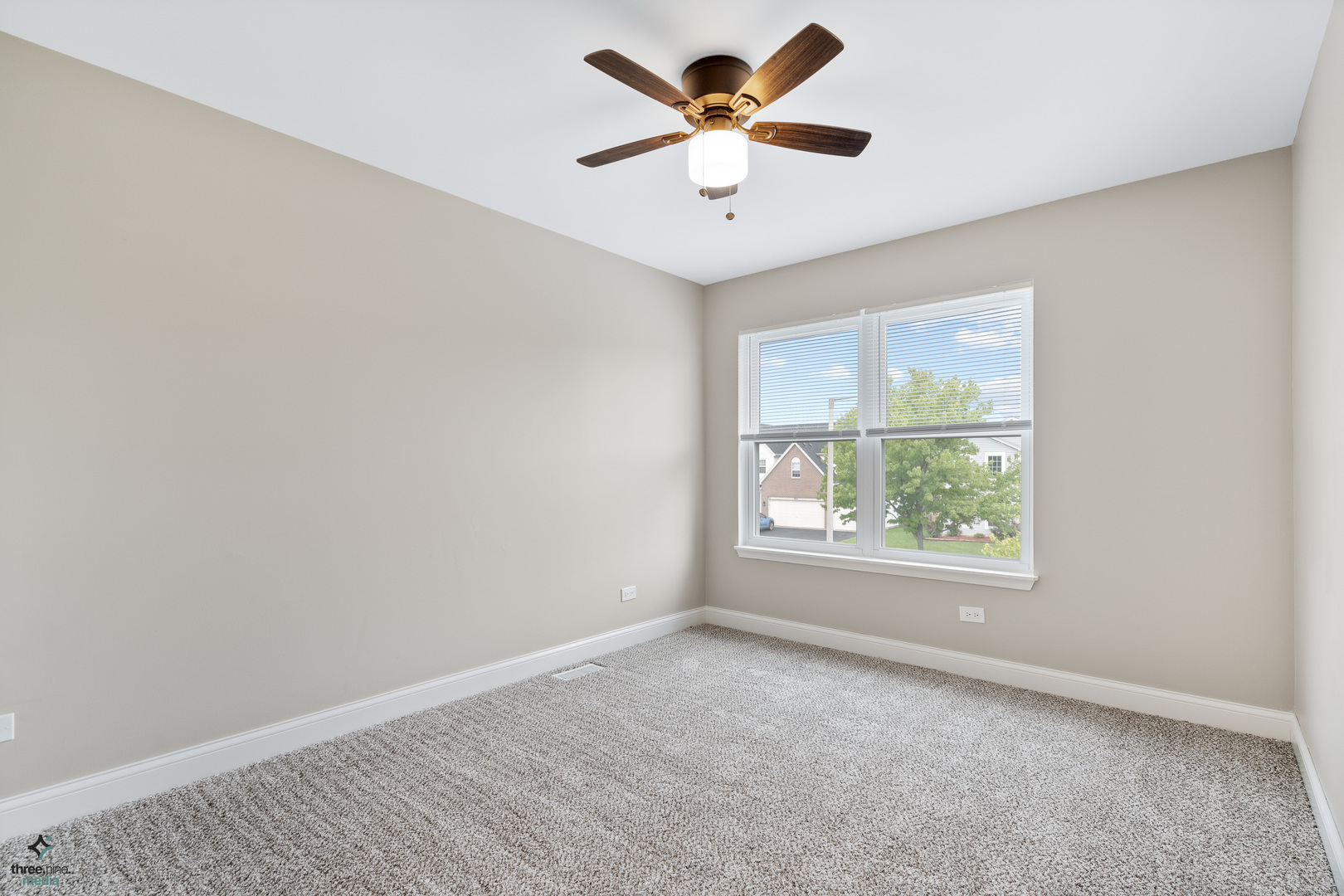 1809 Prairie Ridge Drive Plainfield, IL 60586 - Photo 20 of 32 an empty room with a window and a fan