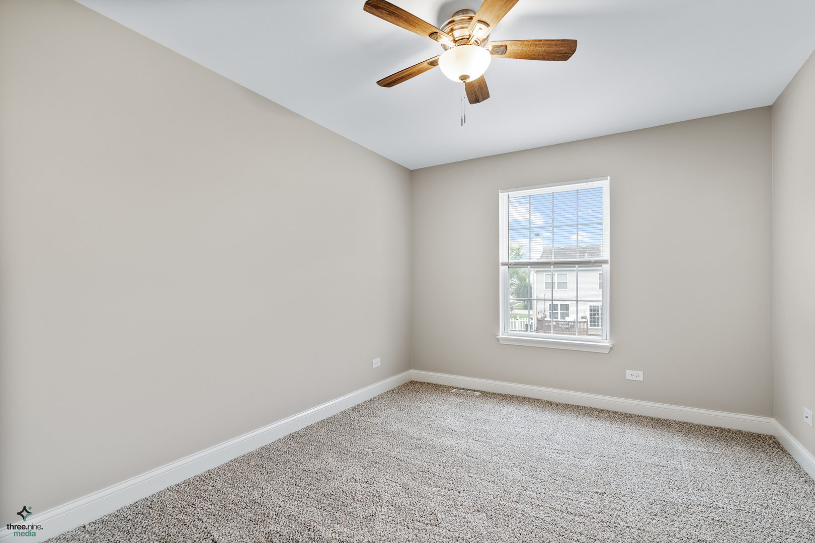 1809 Prairie Ridge Drive Plainfield, IL 60586 - Photo 21 of 32 an empty room with a window and a fan