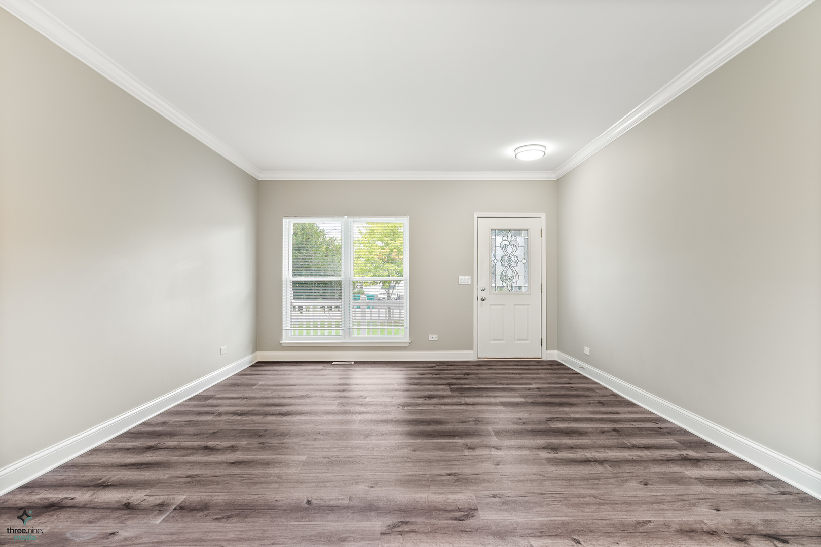 1809 Prairie Ridge Drive Plainfield, IL 60586 - Photo 4 of 32 wooden floor in an empty room with a window