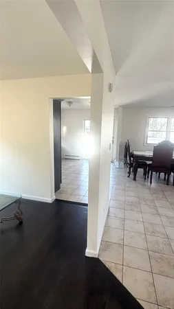 an entryway in a hall with a window