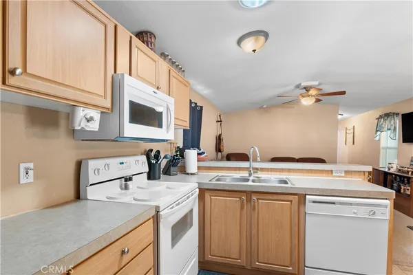 a kitchen with a table and chairs in it