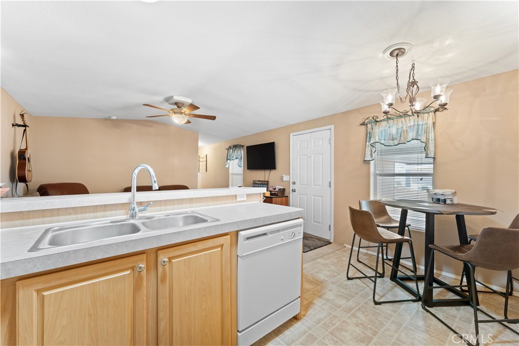 5900 Colorado River Road, Unit 18 Blythe, CA 92225 - Photo 16 of 58 a kitchen with a table and chairs in it