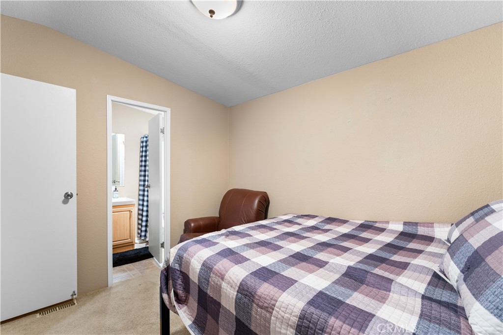 5900 Colorado River Road, Unit 18 Blythe, CA 92225 - Photo 21 of 58 a bedroom with a bed and a cabinets