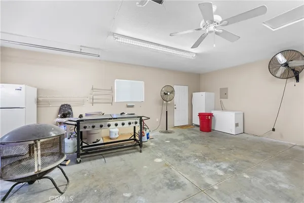 a view of storage and utility room with washer and dryer