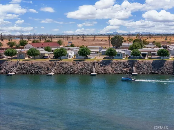 a view of a lake with a house in the background