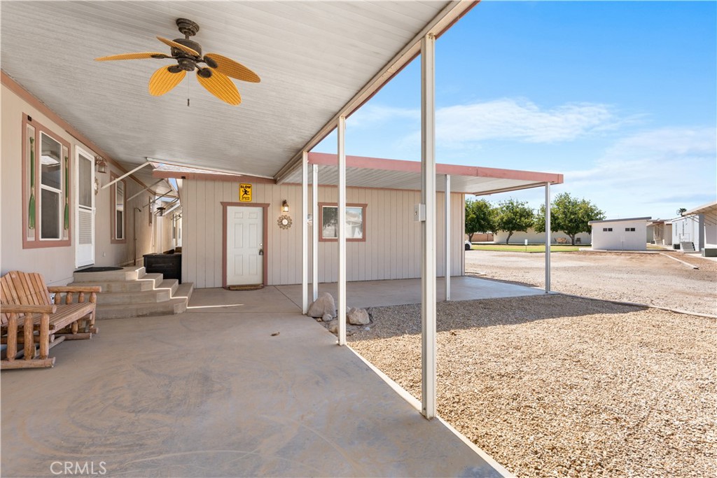 5900 Colorado River Road, Unit 18 Blythe, CA 92225 - Photo 6 of 58 a view of a porch with a table and chairs
