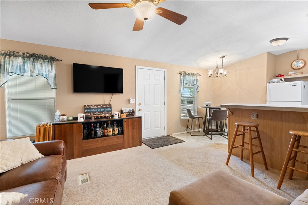 5900 Colorado River Road, Unit 18 Blythe, CA 92225 - Photo 10 of 58 a living room with furniture and a flat screen tv
